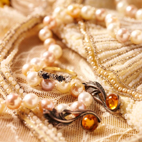pearls and vintage jewelry on lace